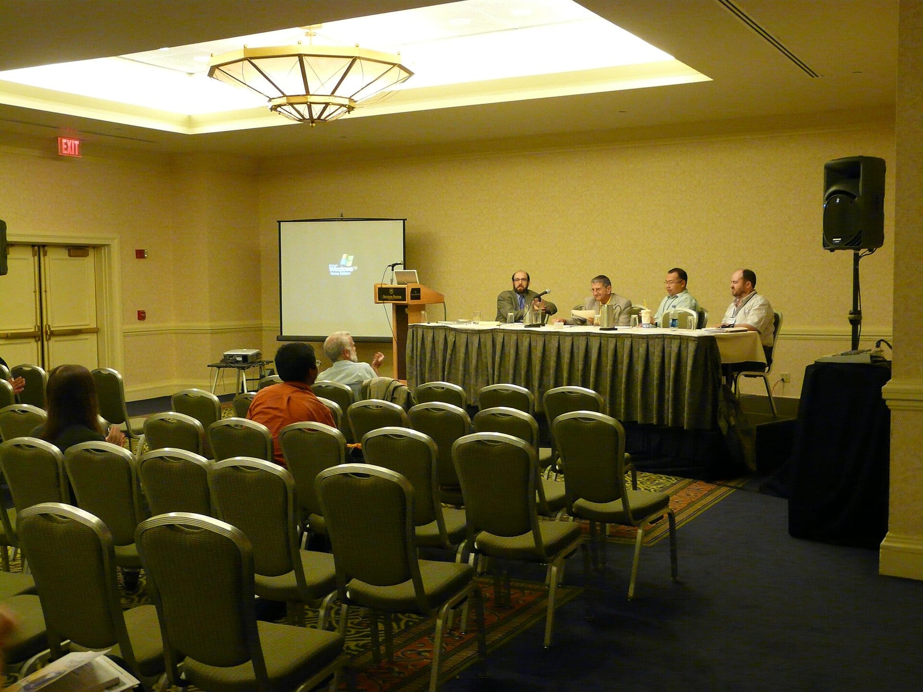 Delegates seated at a conference session